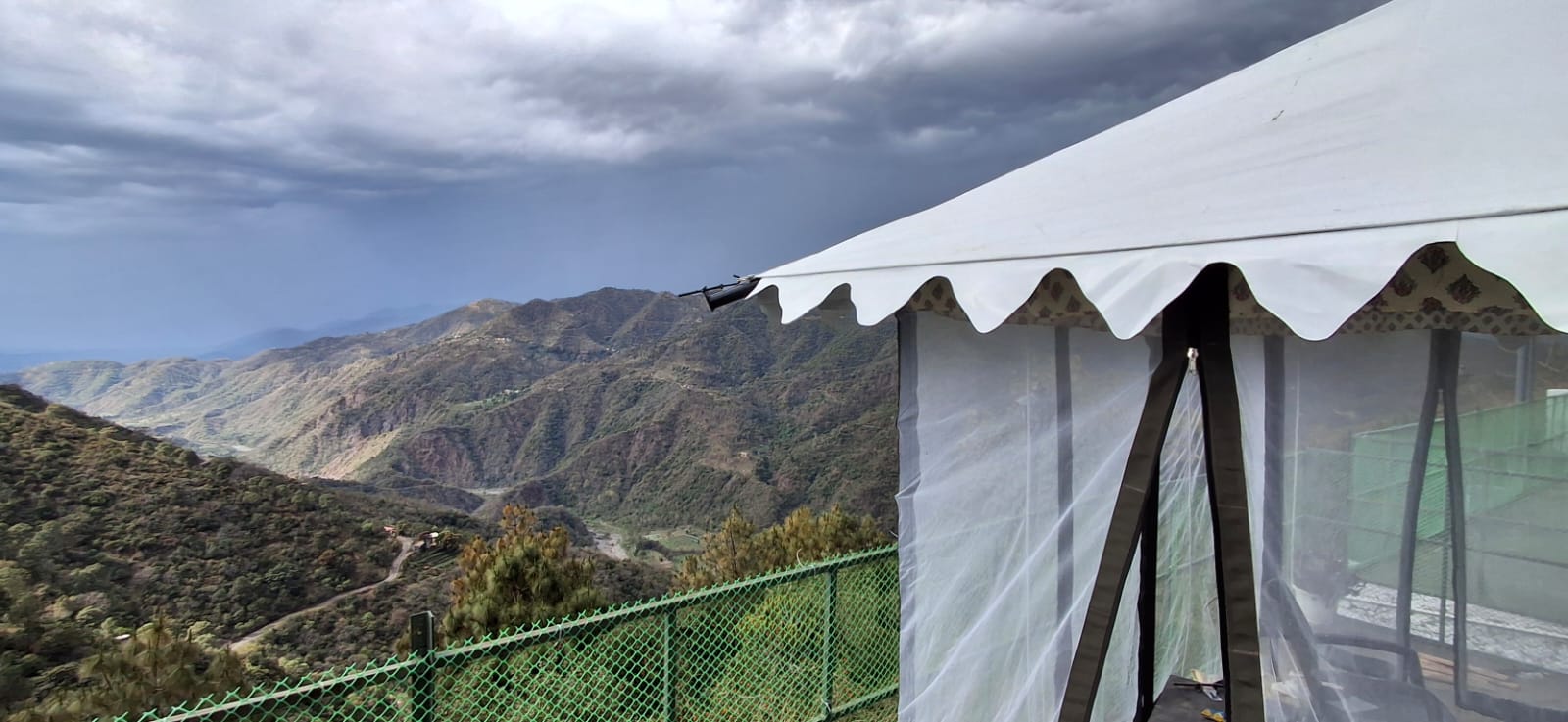 Hilltop Premium AC Swiss Tent with dramatic Morni valley and mountain backdrop